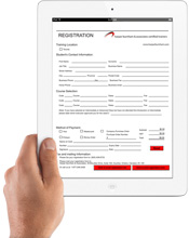 hand holding tablet device to fill in registration form